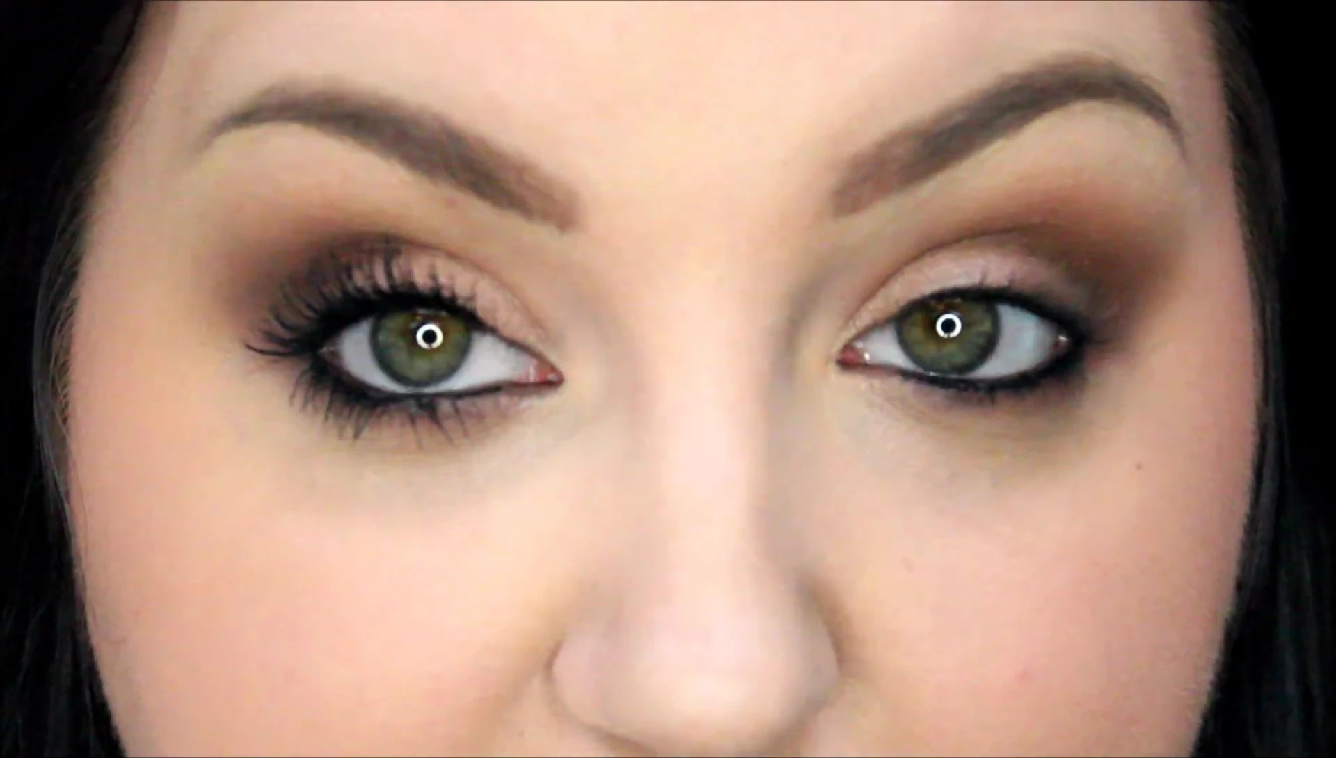 A comparison shot of the reviewer's eyes before and after mascara application.