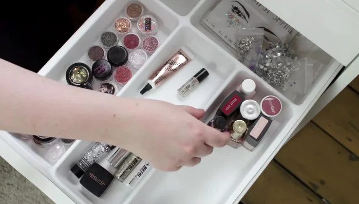 Store nail polishes, cuticle oil, nail hardener, false eyelash glue, and false eyelashes in a separate section of the drawer.