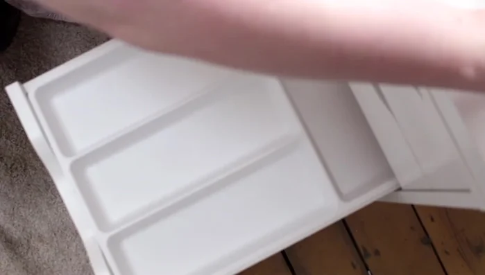 Store mascaras, brow products, and eyeliner pencils in designated sections within the drawer.