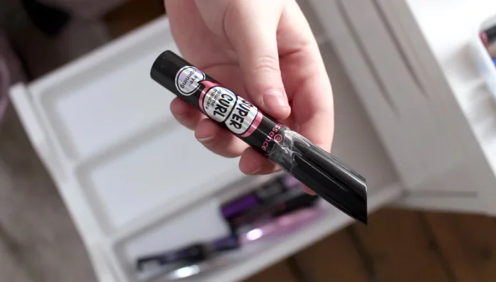 Store mascaras, brow products, and eyeliner pencils in designated sections within the drawer.