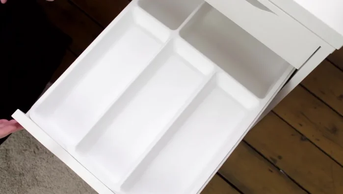 Store nail polishes, cuticle oil, nail hardener, false eyelash glue, and false eyelashes in a separate section of the drawer.