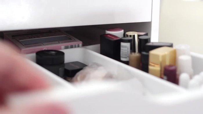 Store nail polishes, cuticle oil, nail hardener, false eyelash glue, and false eyelashes in a separate section of the drawer.