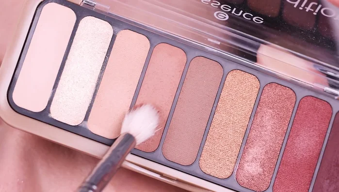 Deepen the crease further with matte black eyeshadow, using a tiny brush.