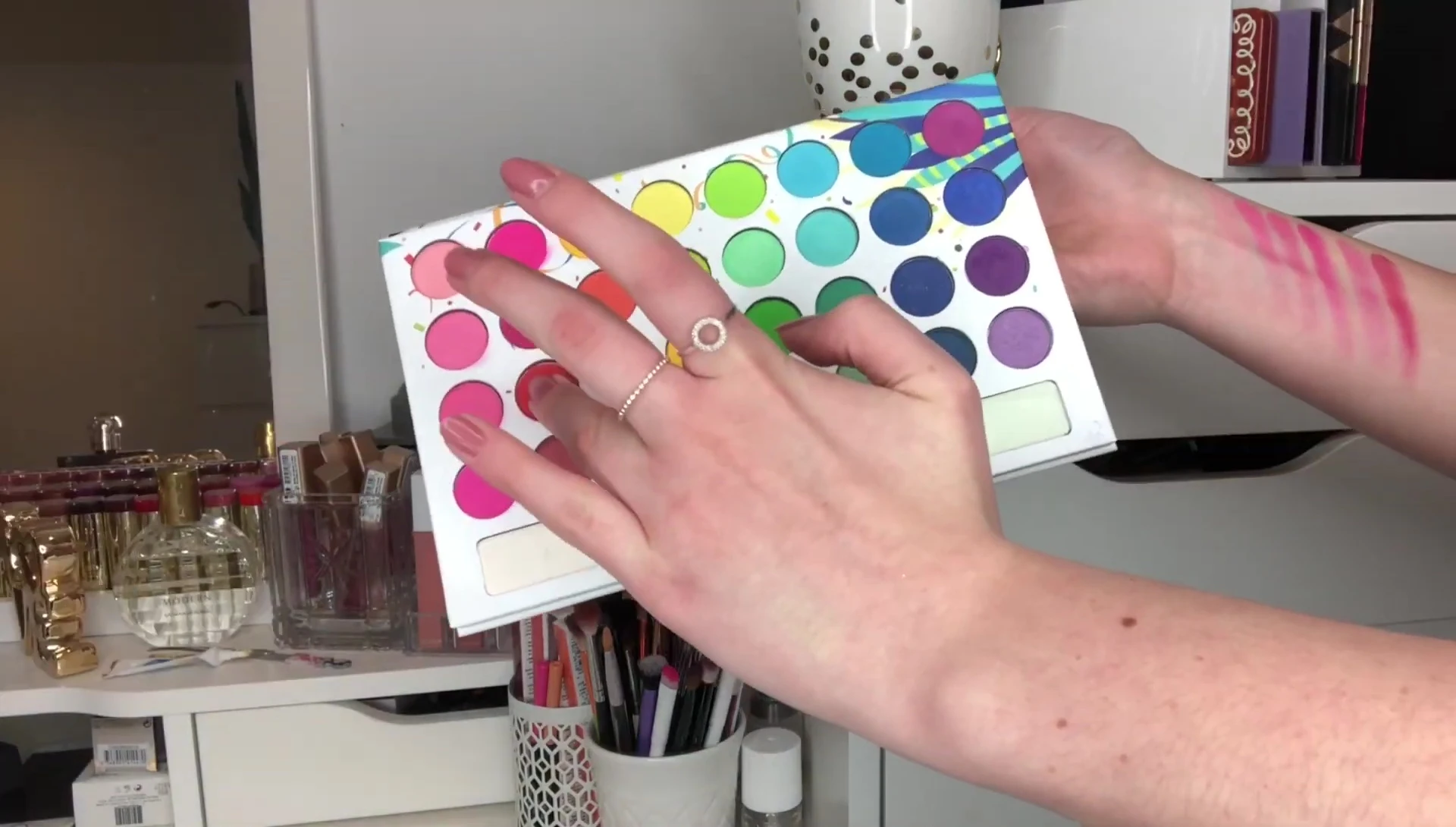 Swatches of the eyeshadows on the back of the hand, showing the color payoff.