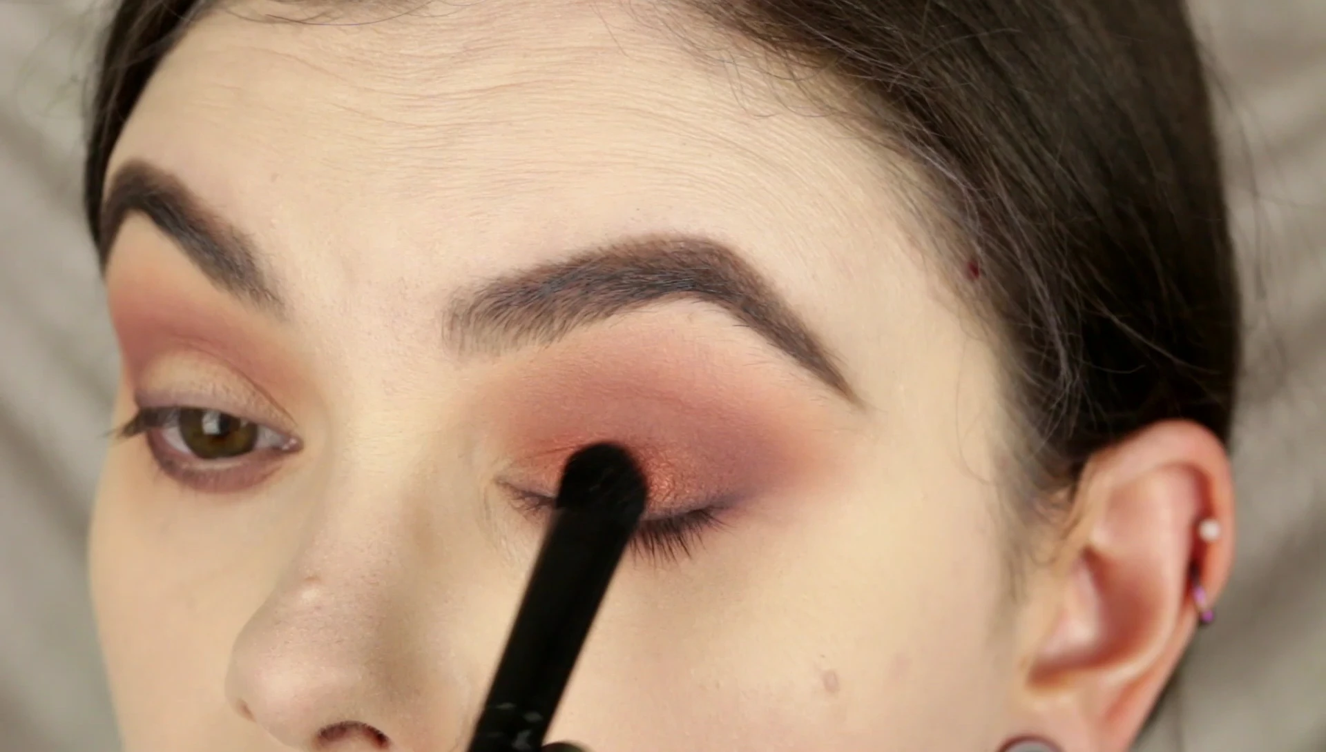 Applying the coppery orange shade