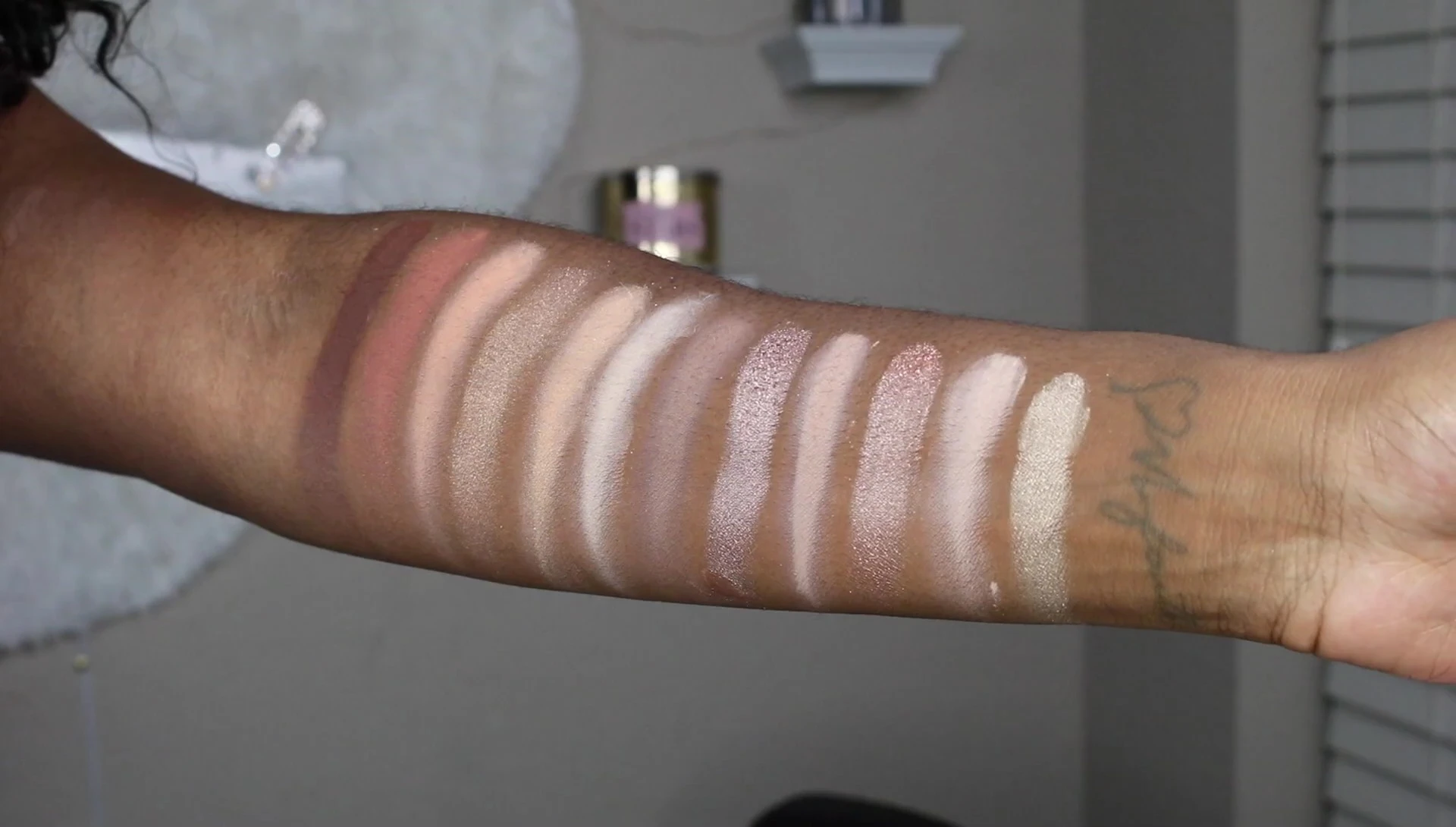 Swatches of the eyeshadow shades on the arm.