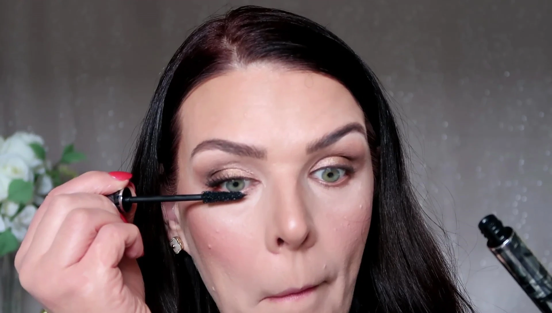 The completed eye look with false eyelashes.