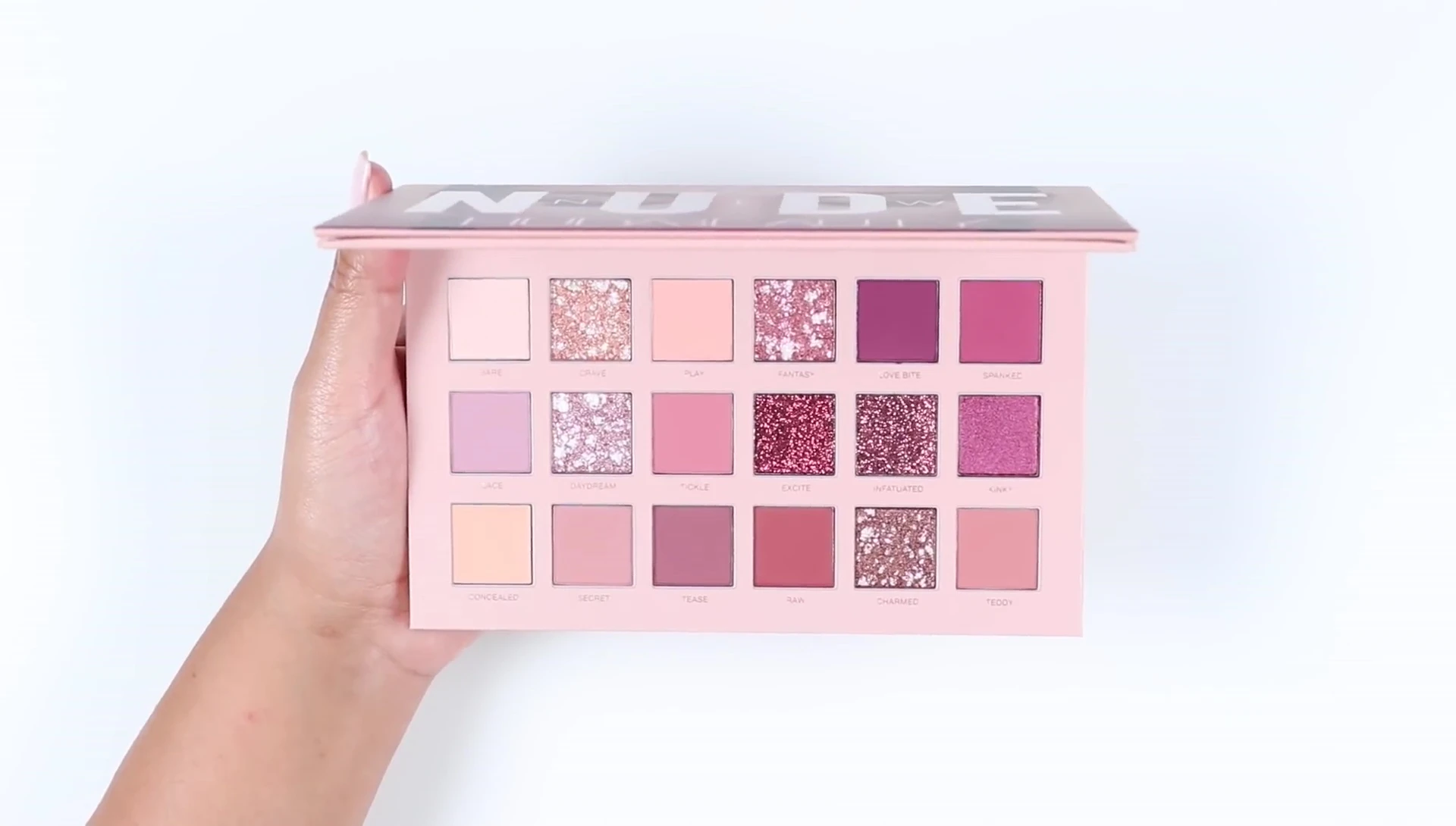 Close-up shot of the matte eyeshadow swatches on the arm.