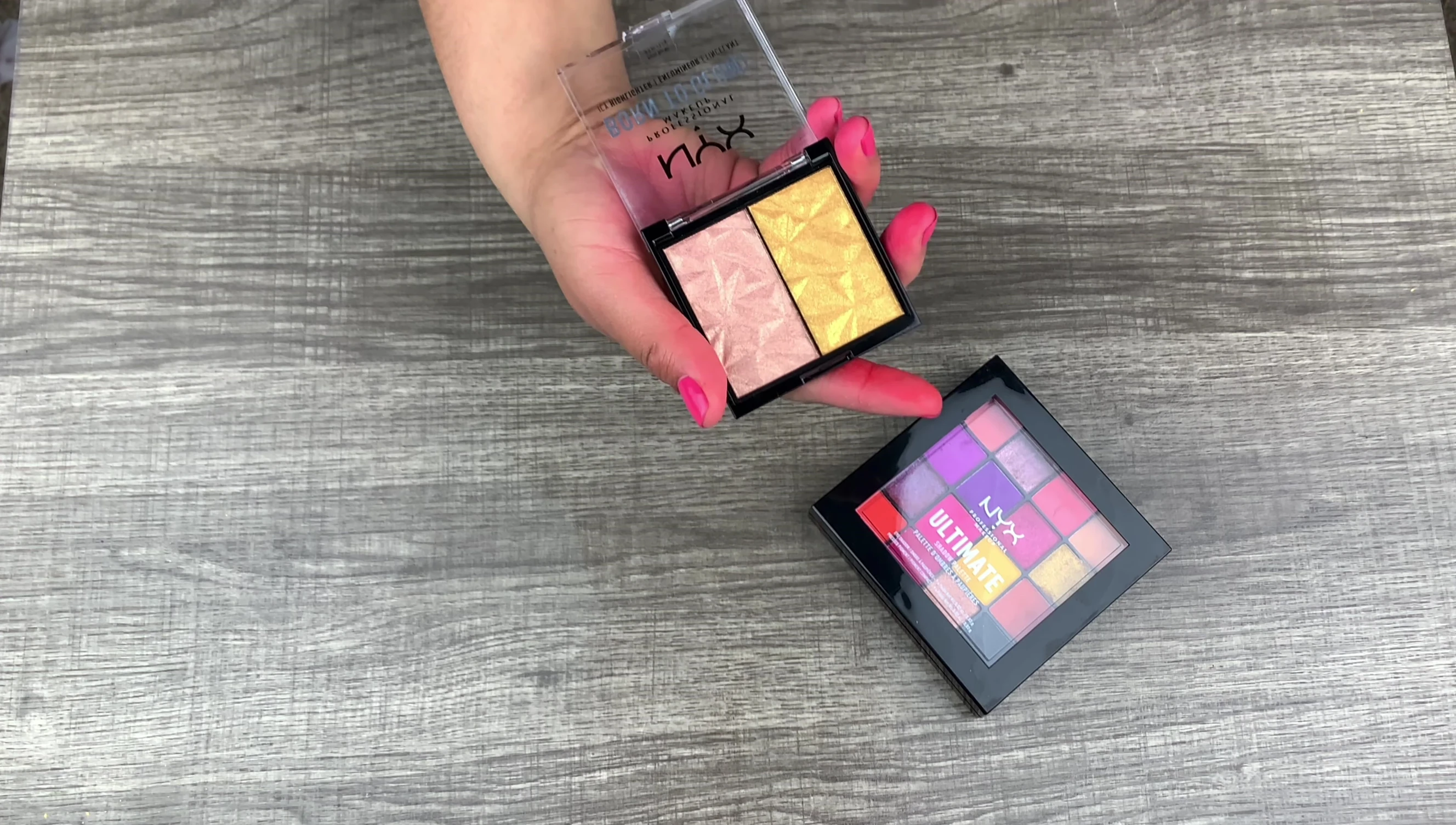 The reviewer is preparing to swatch the highlighters.