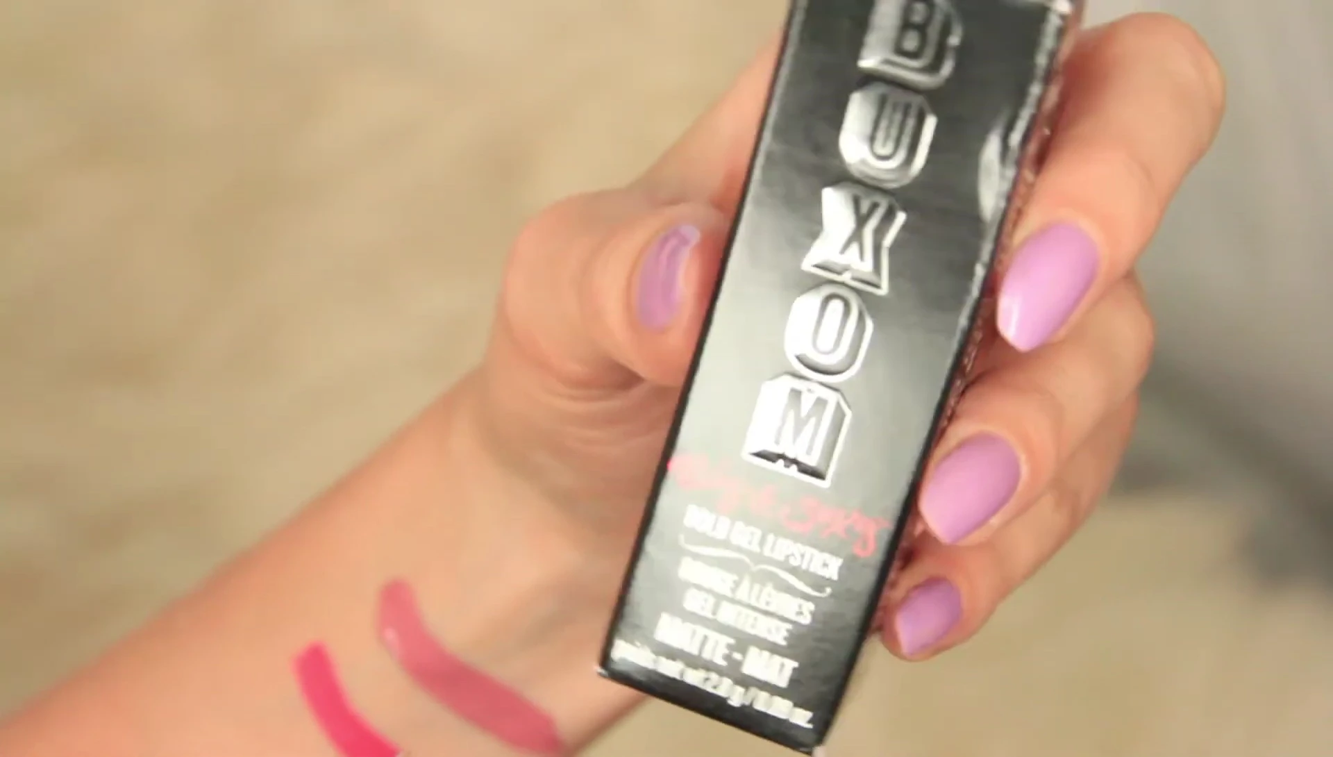 Close-up of the Buxom Big & Sexy Bold Gel Lipstick packaging and the lipstick itself.