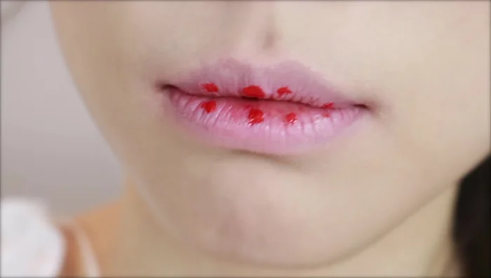 Apply your chosen liquid lipstick or lip tint to the inner part of your lips.