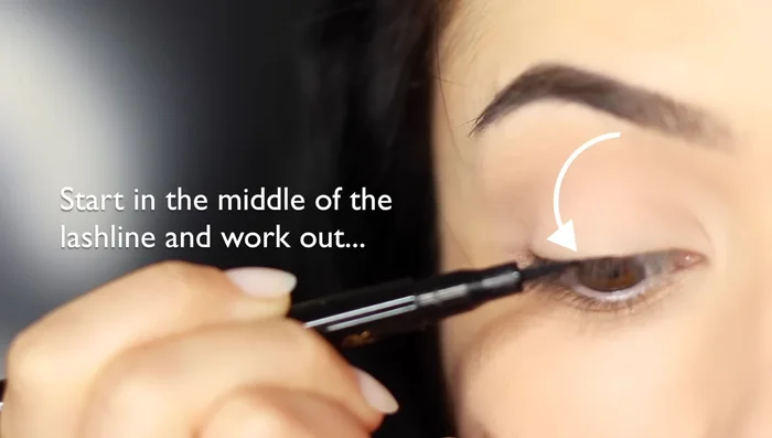 Fold your pinky underneath to get closer access to the outer corner, or switch hands and pull the liner from the outer edge into the center.