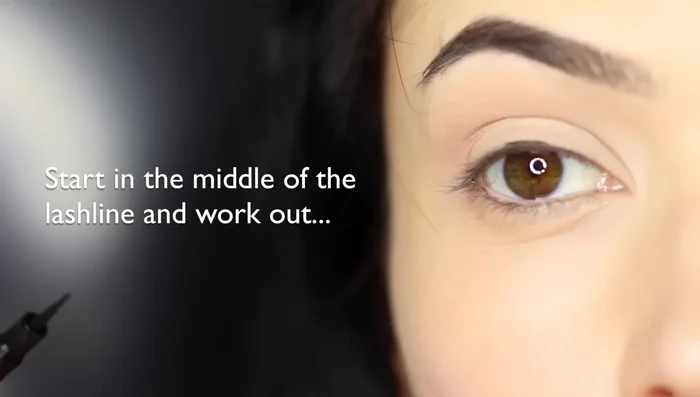 Fold your pinky underneath to get closer access to the outer corner, or switch hands and pull the liner from the outer edge into the center.