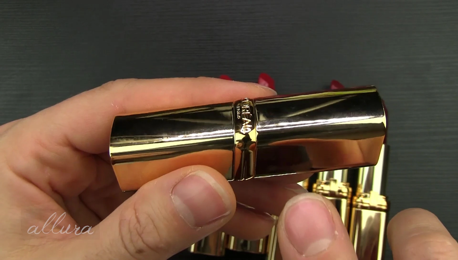 Close-up shot of the gold lipstick tubes.