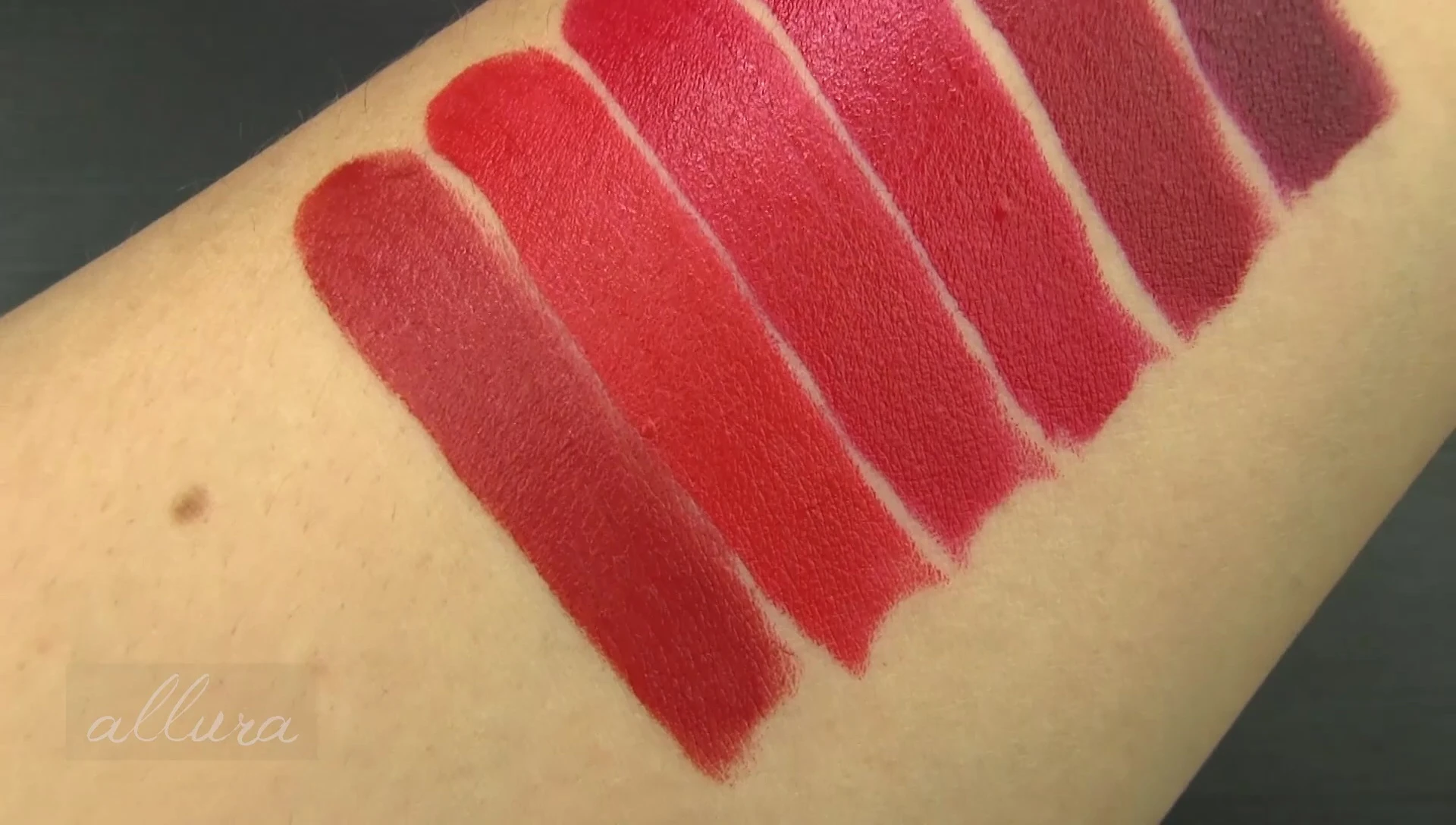 Close up shot of the application of the lipstick.