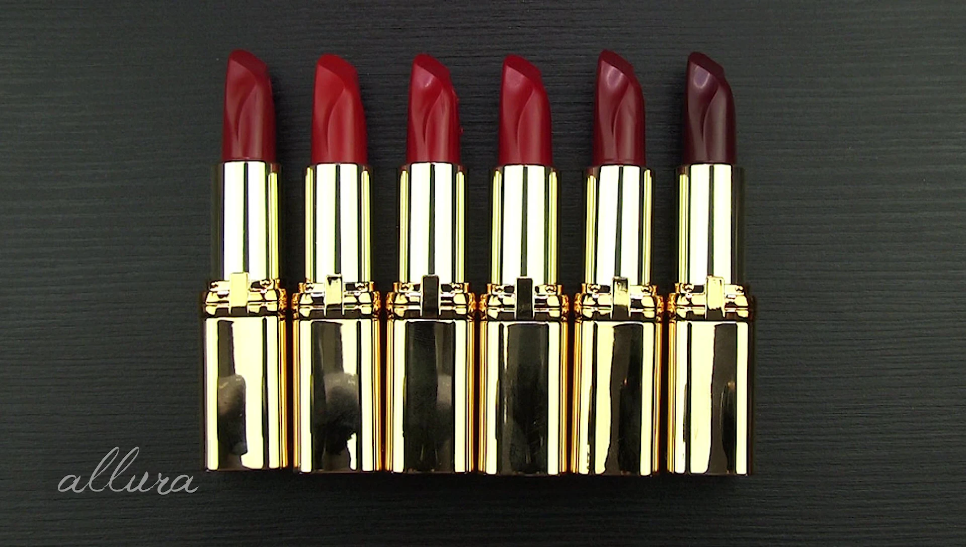 The reviewer is demonstrating the lipstick application