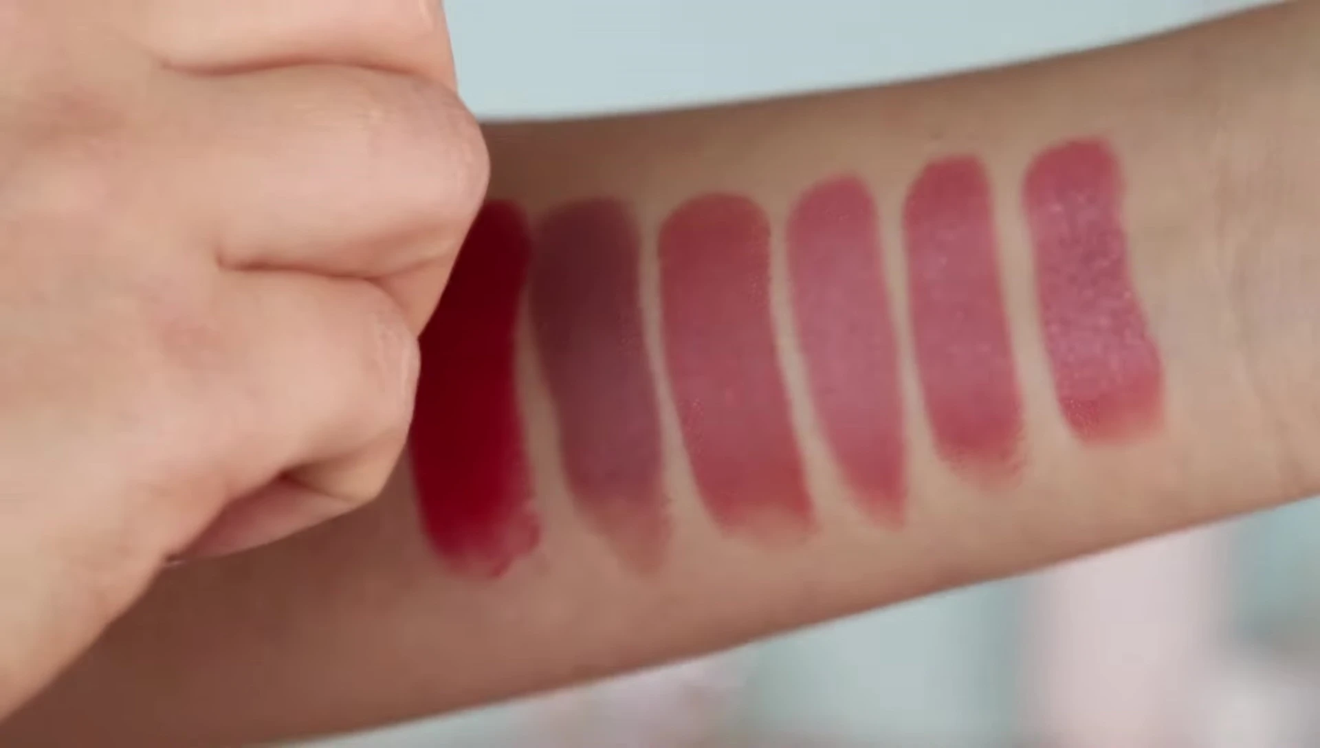 Chili lipstick swatch on the wrist.