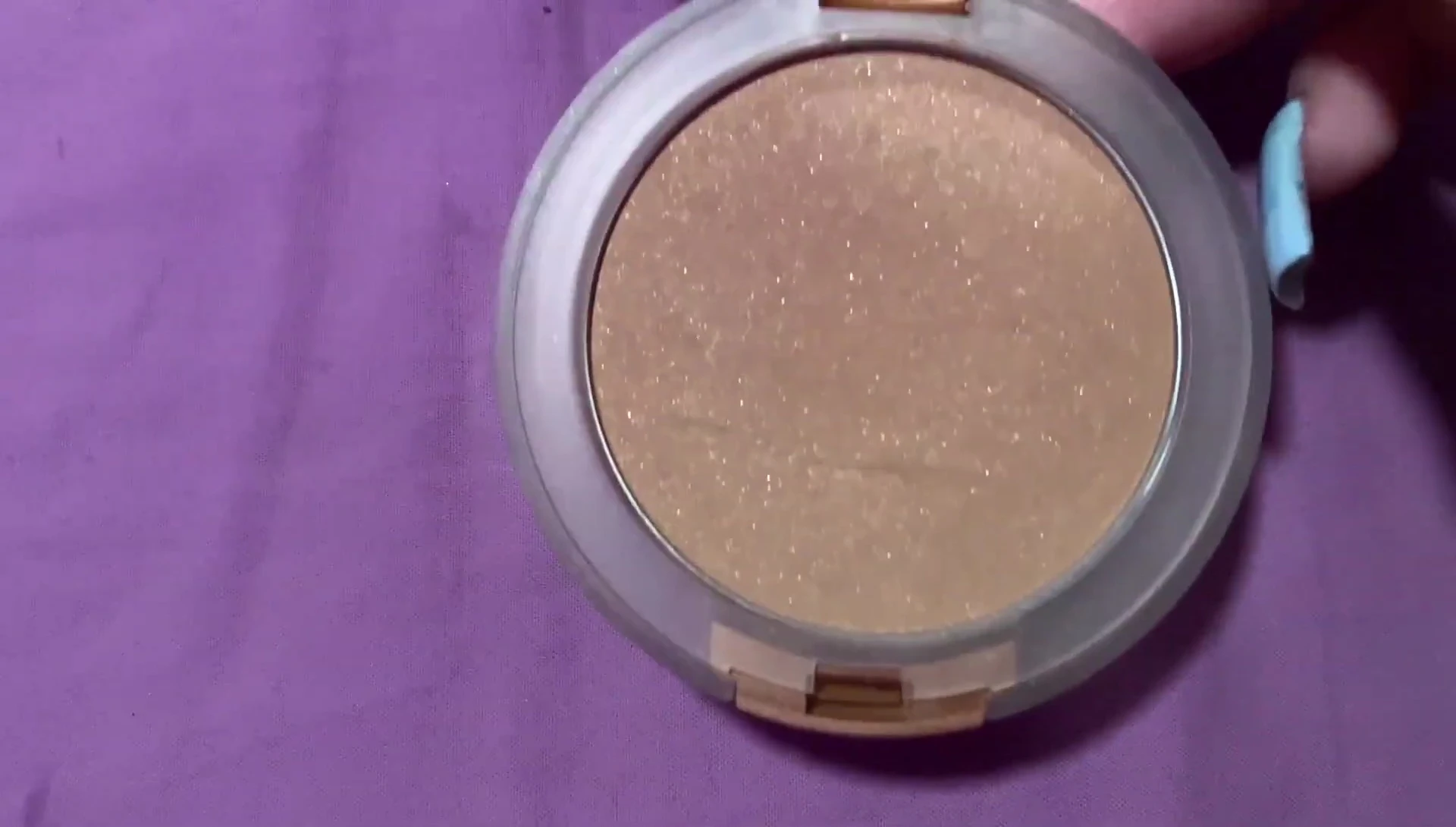 Close-up of the bronzer applied to the skin.