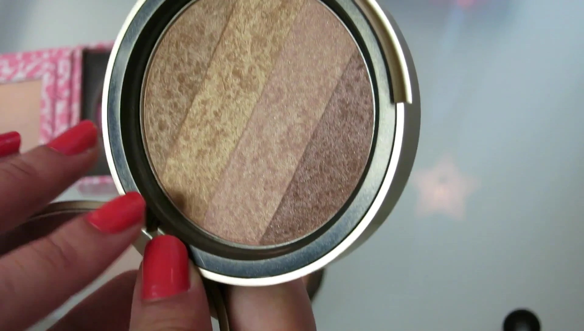 The reviewer demonstrating how to customize the bronzer’s application.