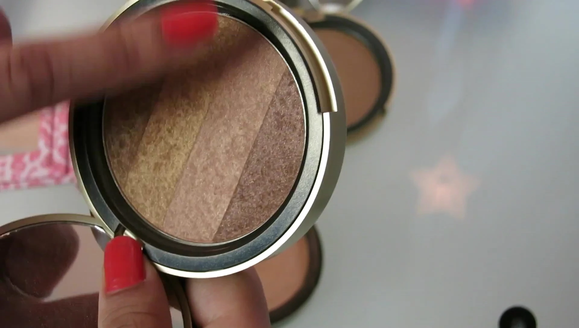 The reviewer showcasing the blended result of the bronzer.