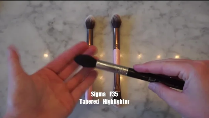 Applying Powder Highlight: Use fluffy brushes for applying powder highlight. Brushes like the Luxie 181 are dual-ended for both cream and powder applications.