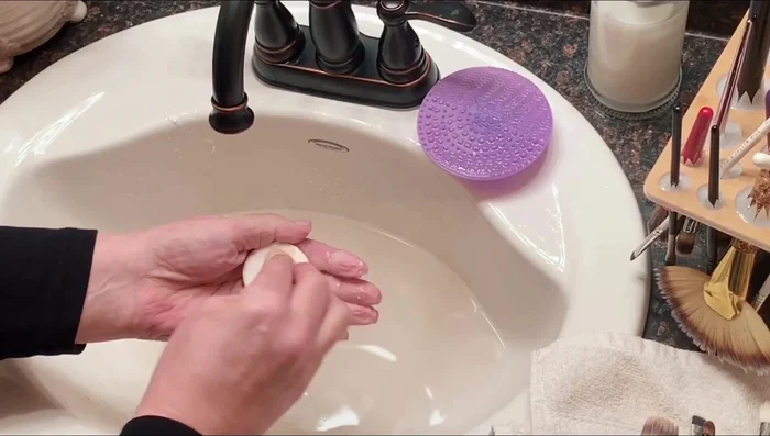Soak sponges in warm water, apply soap and work it in, rinse thoroughly, and squeeze out excess water.