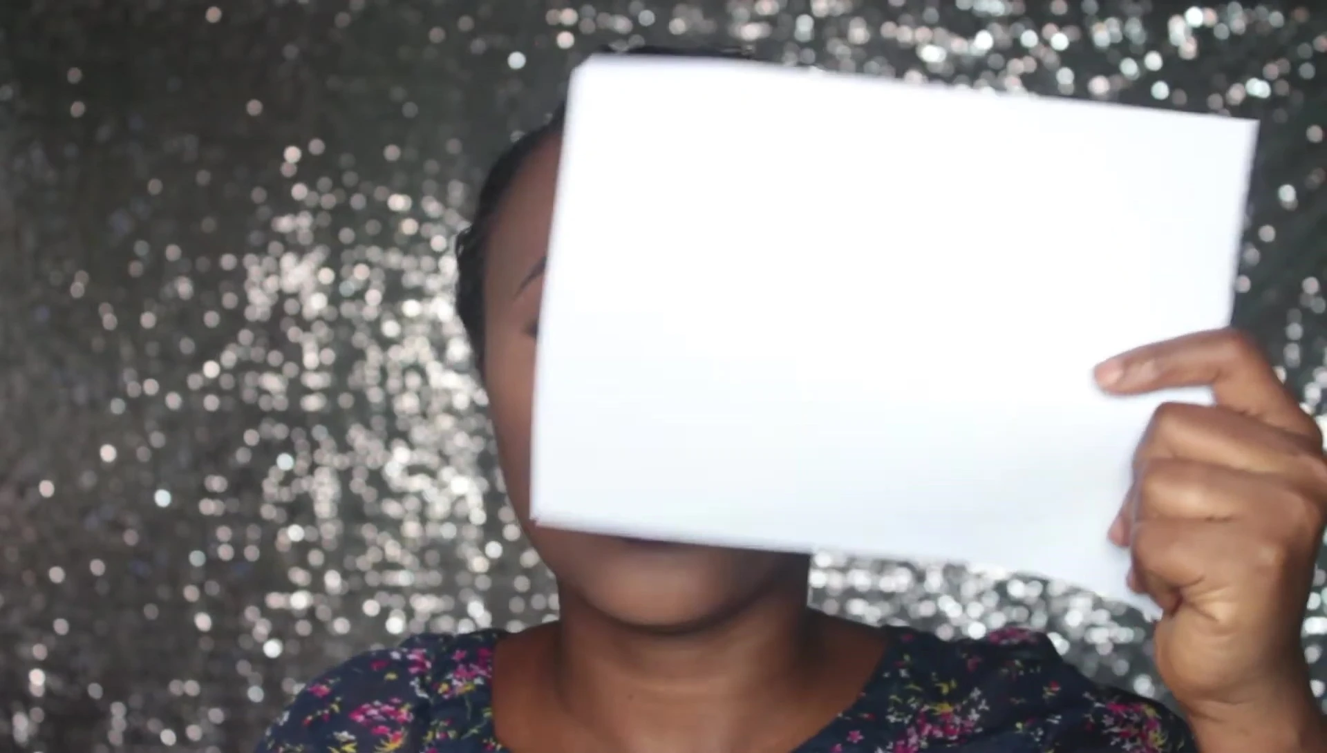 The YouTuber applies the setting sprays, showcasing the differences in initial appearance.