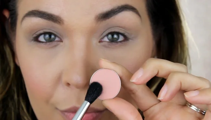 Apply “Warm Peach” eyeshadow to the crease using the pro tapered blending brush, blending using windshield wiper and circular motions.