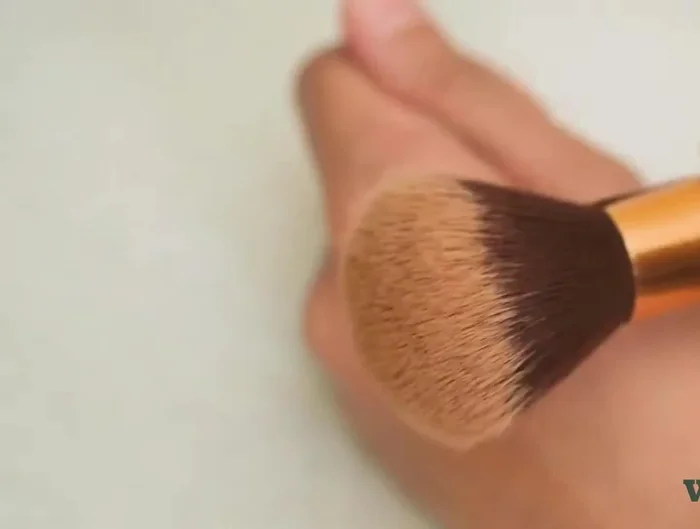 Feather out harsh lines with the brush.