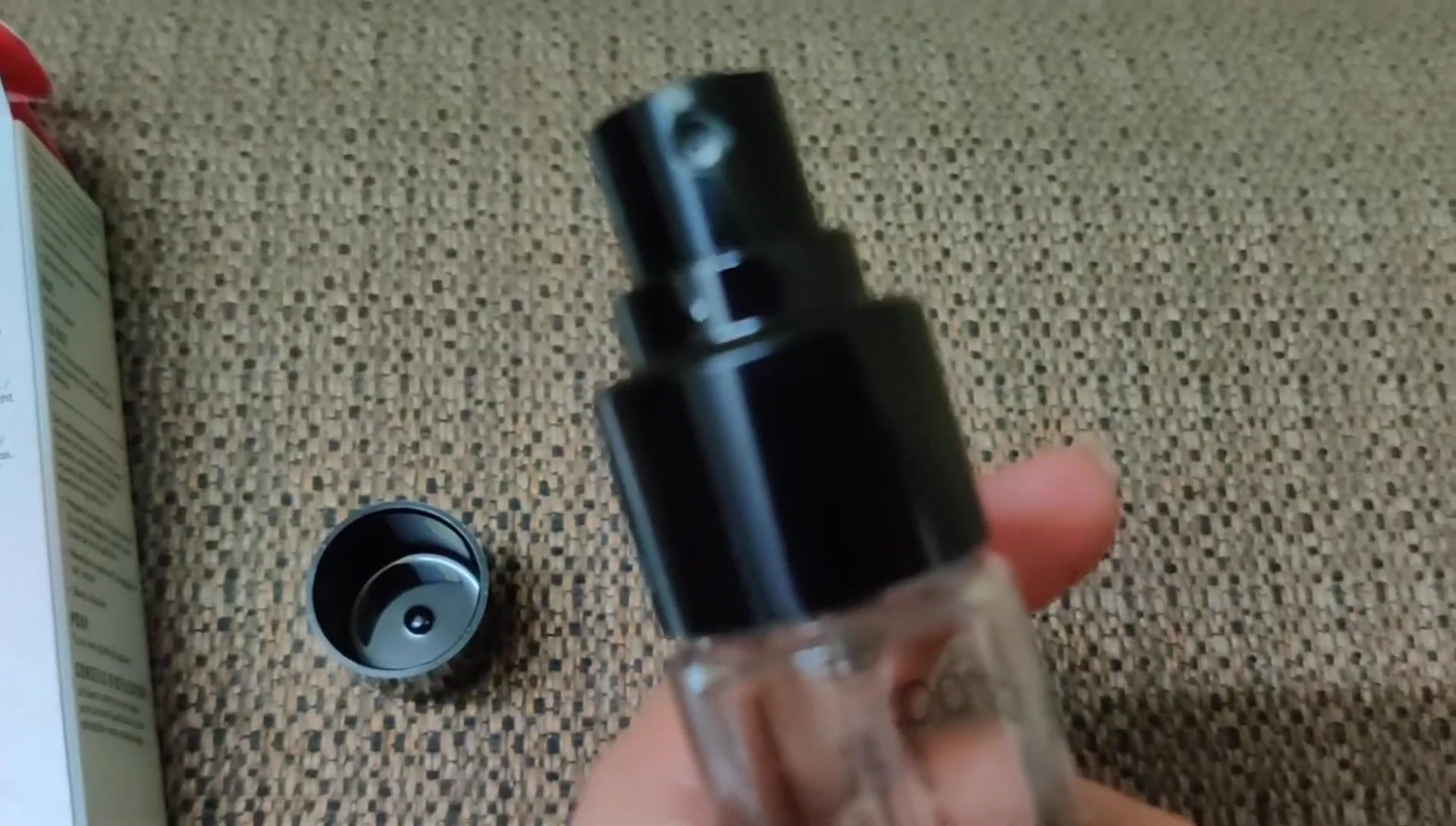 A shot focusing on the spray nozzle of the bottle.