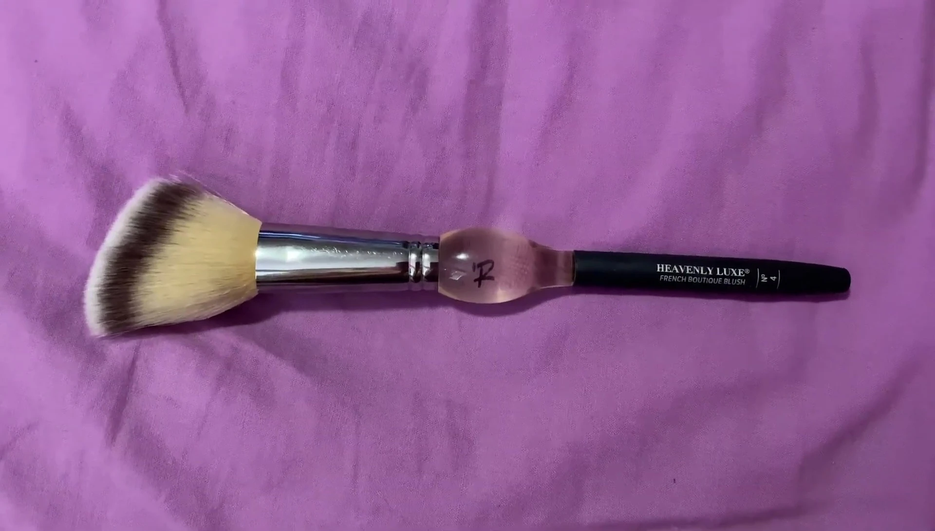 Person holding the brush