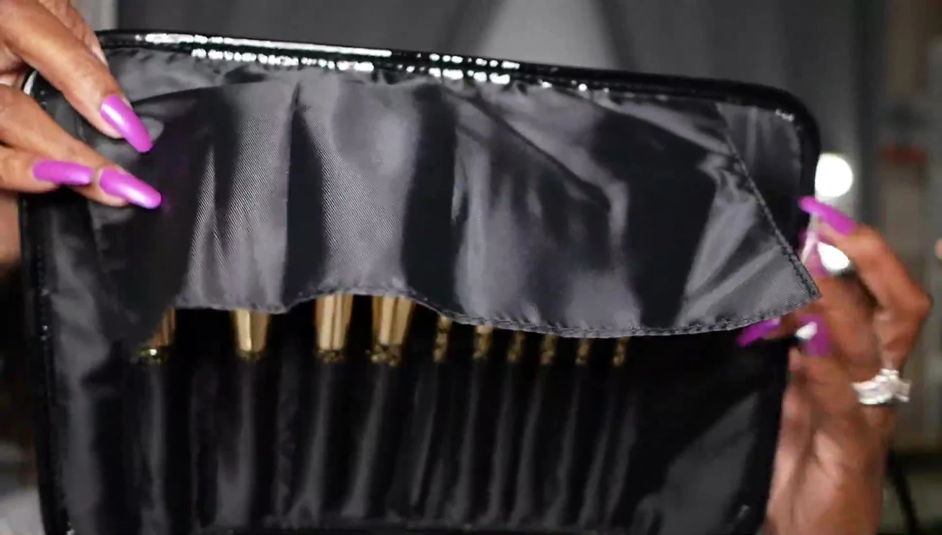 Close-up of the open roll showing the protective flap and individual brush slots.