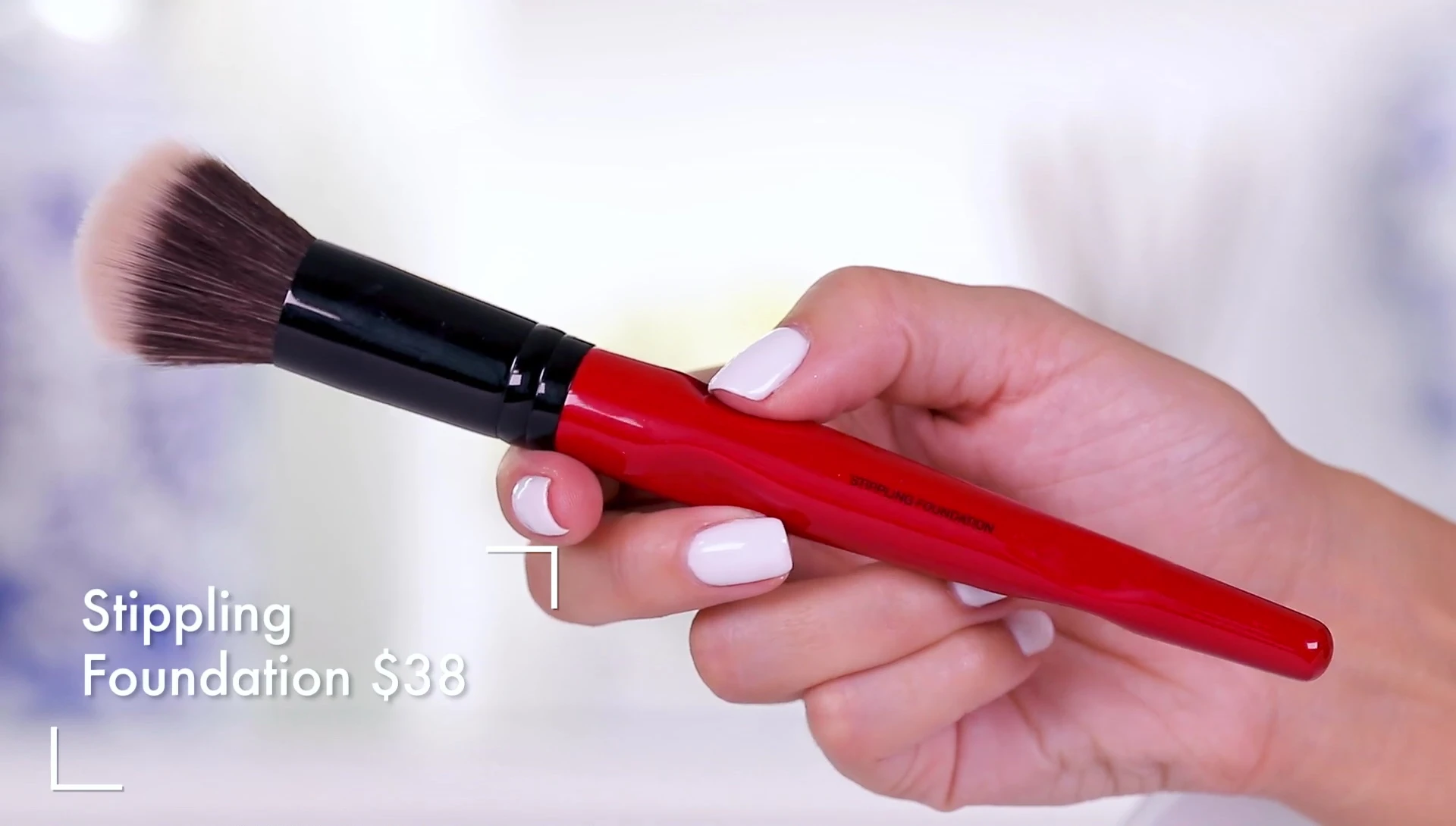 Close-up of the Stippling Foundation brush showing its sloped handle.