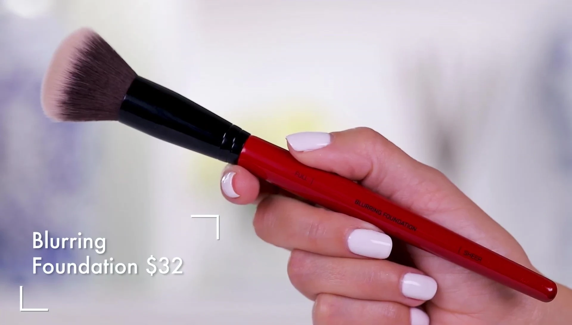The reviewer demonstrating the Blurring Foundation brush.