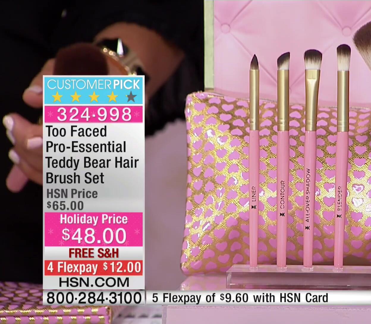 The heart-shaped pouch containing the Too Faced brush set.