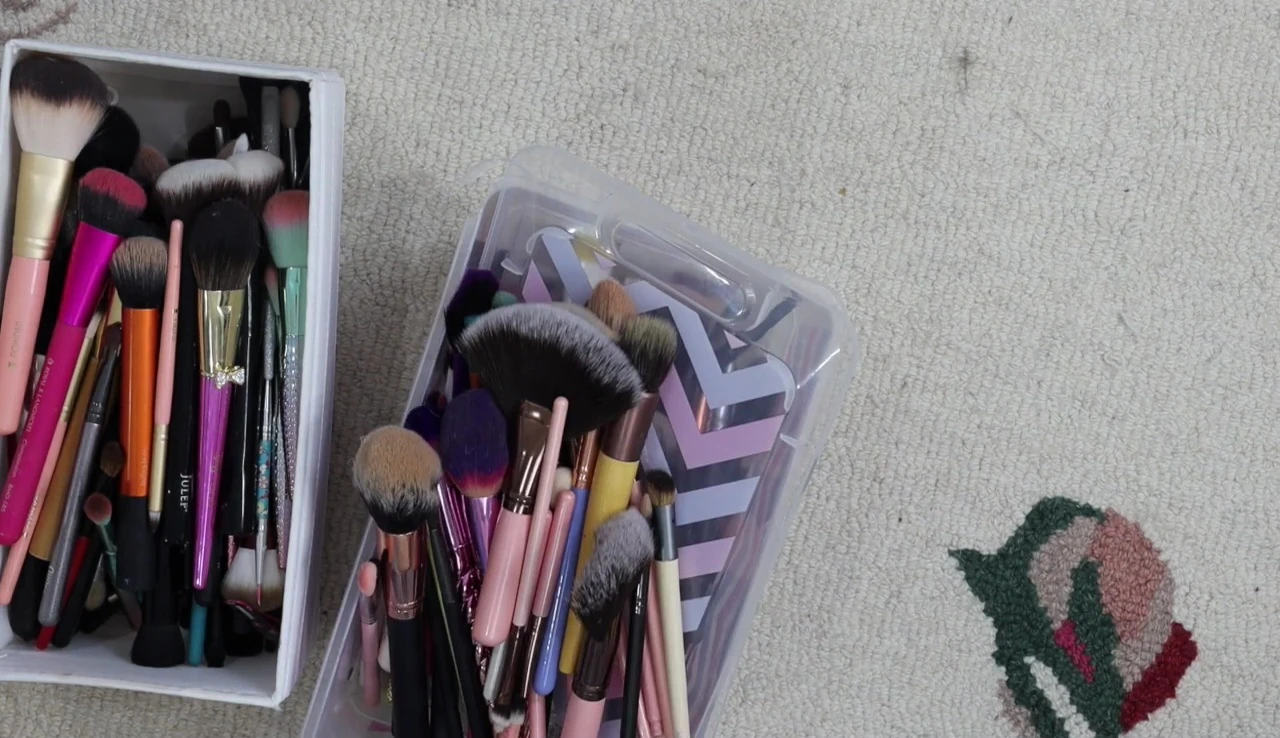 The speaker is organizing her remaining brushes.