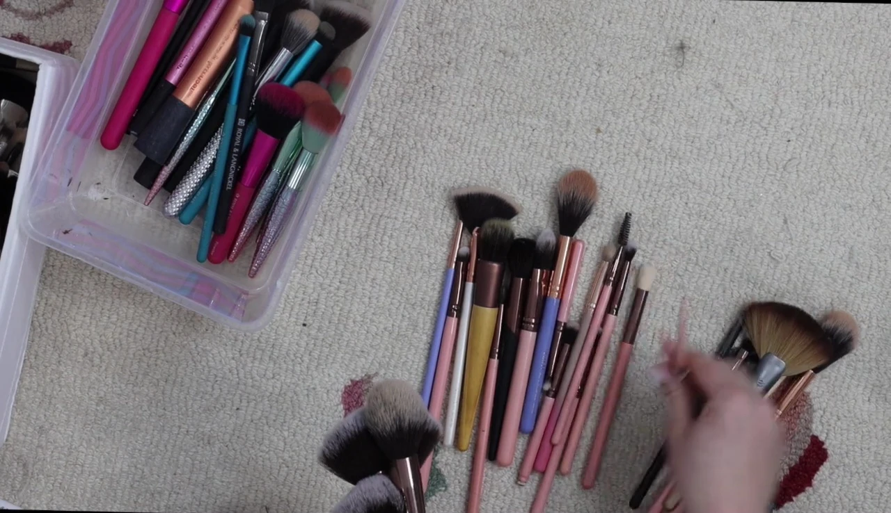 The speaker is gathering her Luxie brushes to sell them.