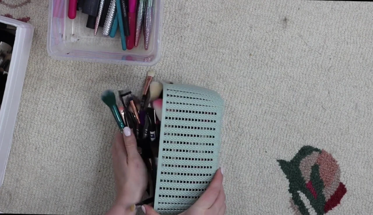 A large, miscellaneous pile of makeup brushes.