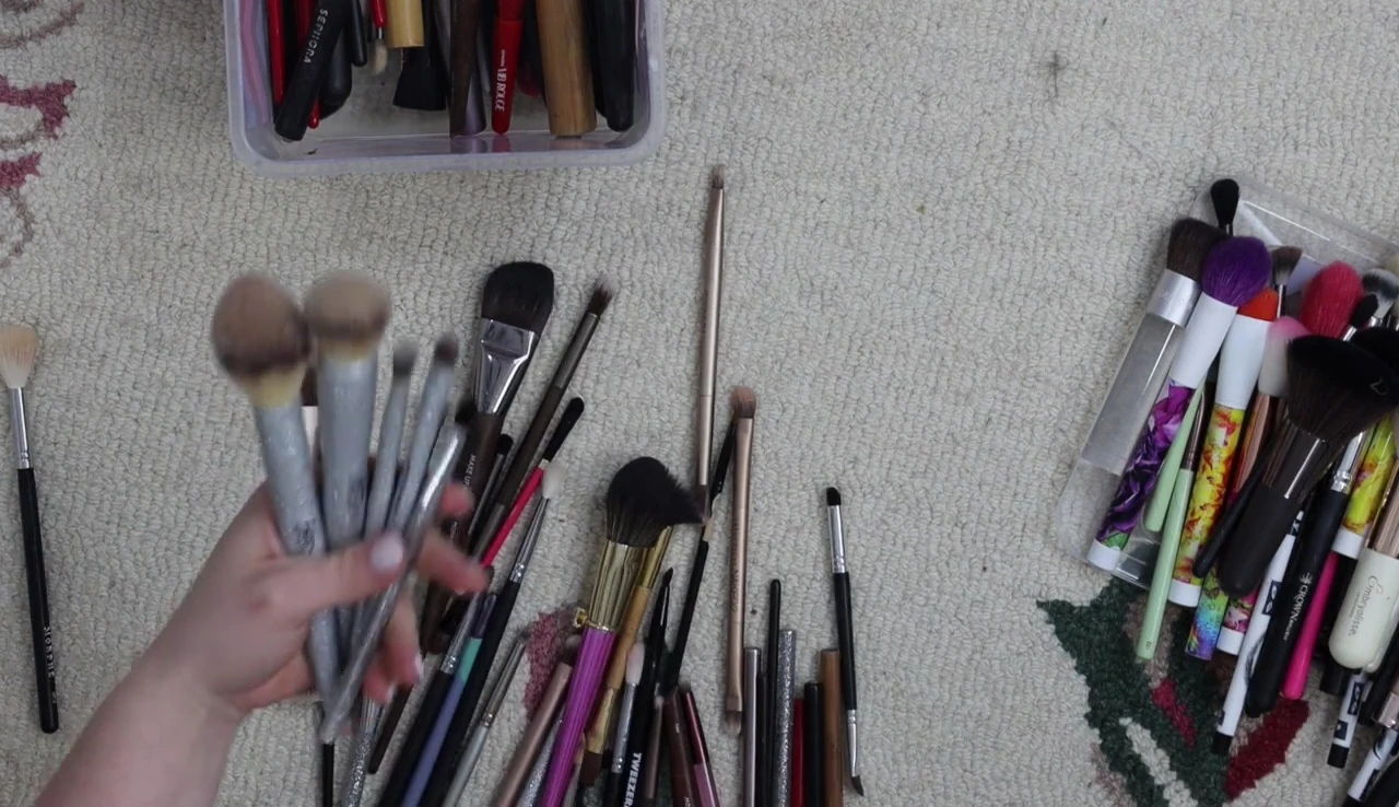 Close-up shot of the IT Cosmetics brush being considered for keeping.