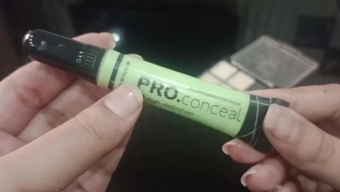 Apply skin-toned concealer and foundation to set the green corrector and create a flawless base.