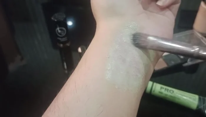 Apply skin-toned concealer and foundation to set the green corrector and create a flawless base.