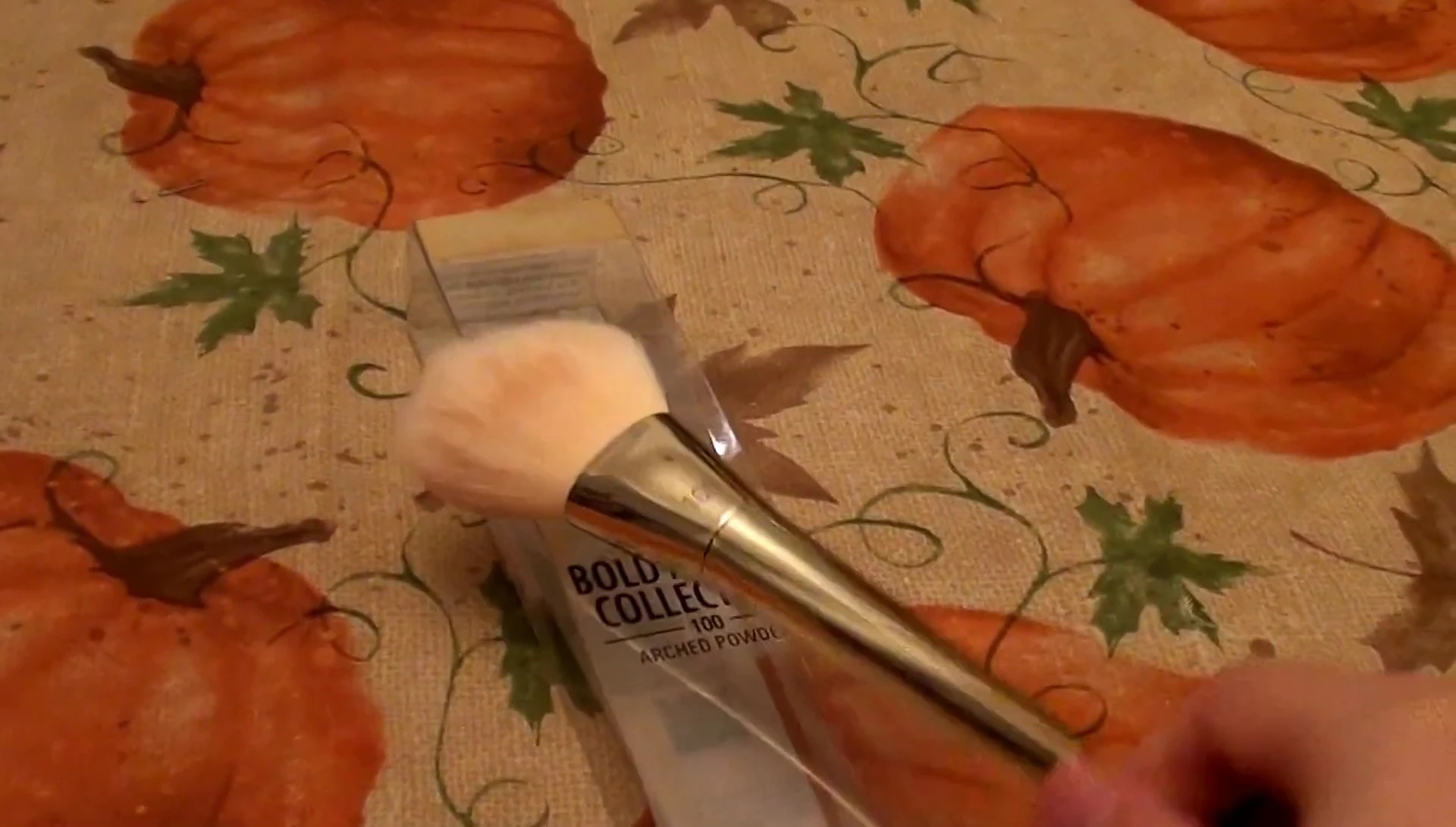 The reviewer showcasing the even application achieved with the brush.