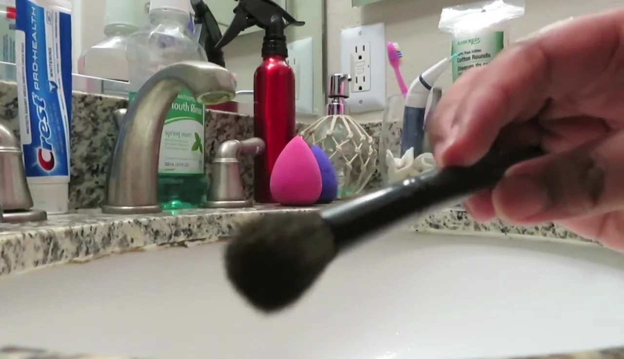 The brush being cleaned with the solid soap.