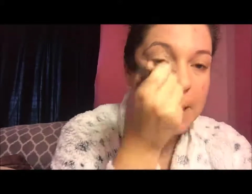 One side of the face with foundation applied using the brush.