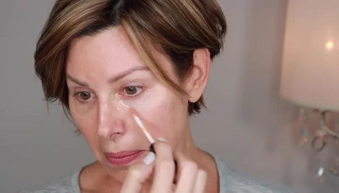 Apply Sephora Bright Future Color Corrector in Melon to neutralize dark circles.