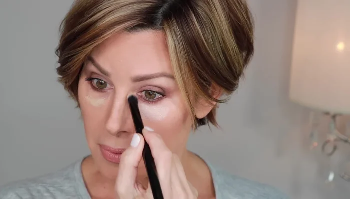 Apply a tiny amount of It Cosmetics Bye Bye Under Eye Concealer and blend it thoroughly using a brush.