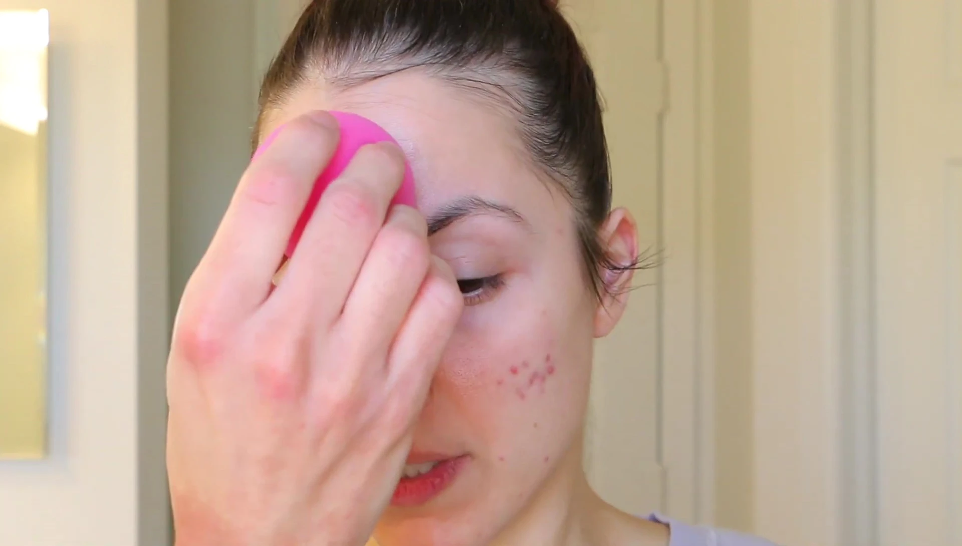 Applying foundation with the sponge