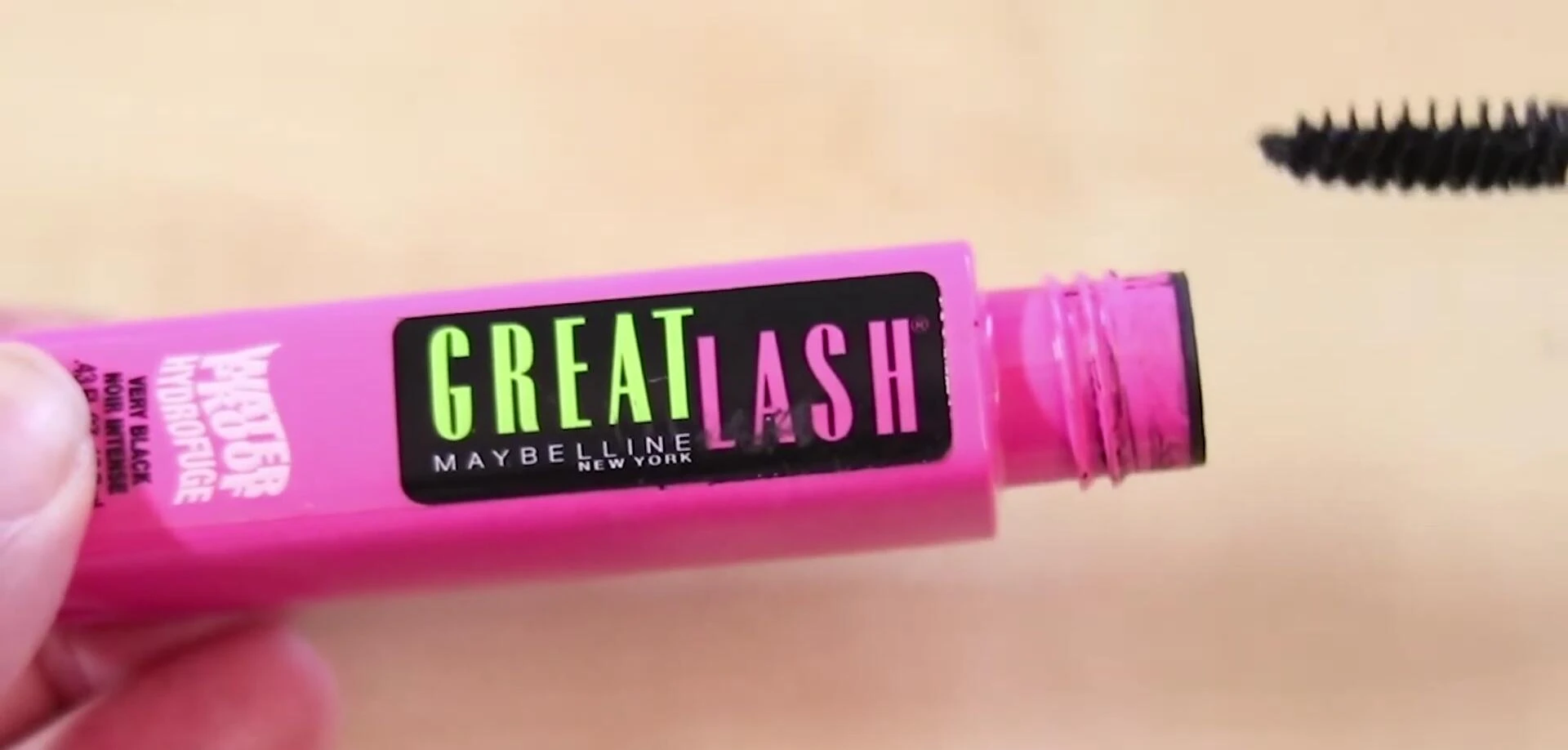 Close-up shot of the Maybelline Great Lash Mascara packaging, showcasing the pink and green design.