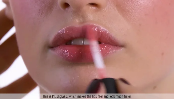 Finish with a volumizing lip gloss for a complete summer look.