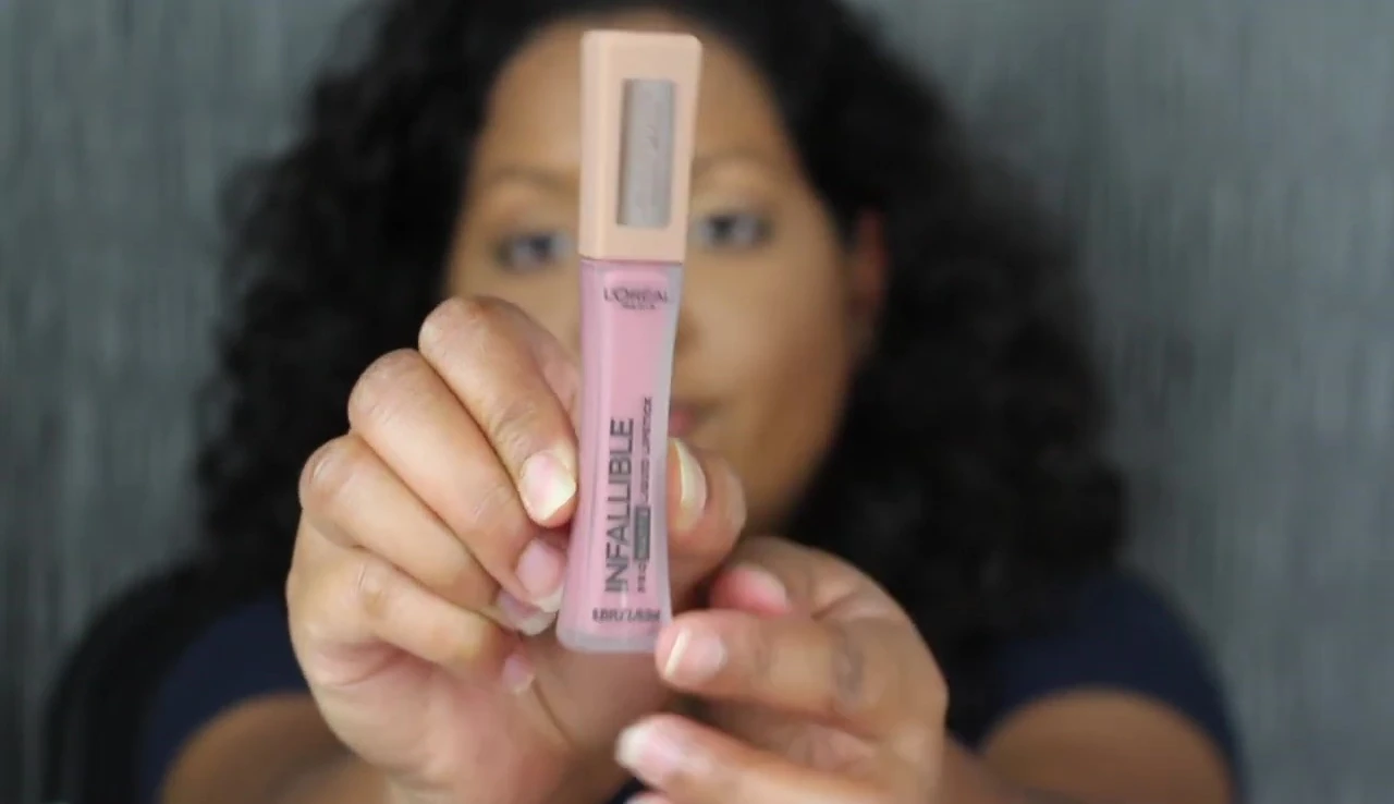 Close-up shot of the L'Oréal Infallible Pro Matte Liquid Lipstick Les Chocolates packaging, showcasing the frosted glass bottle and chocolate detailing.